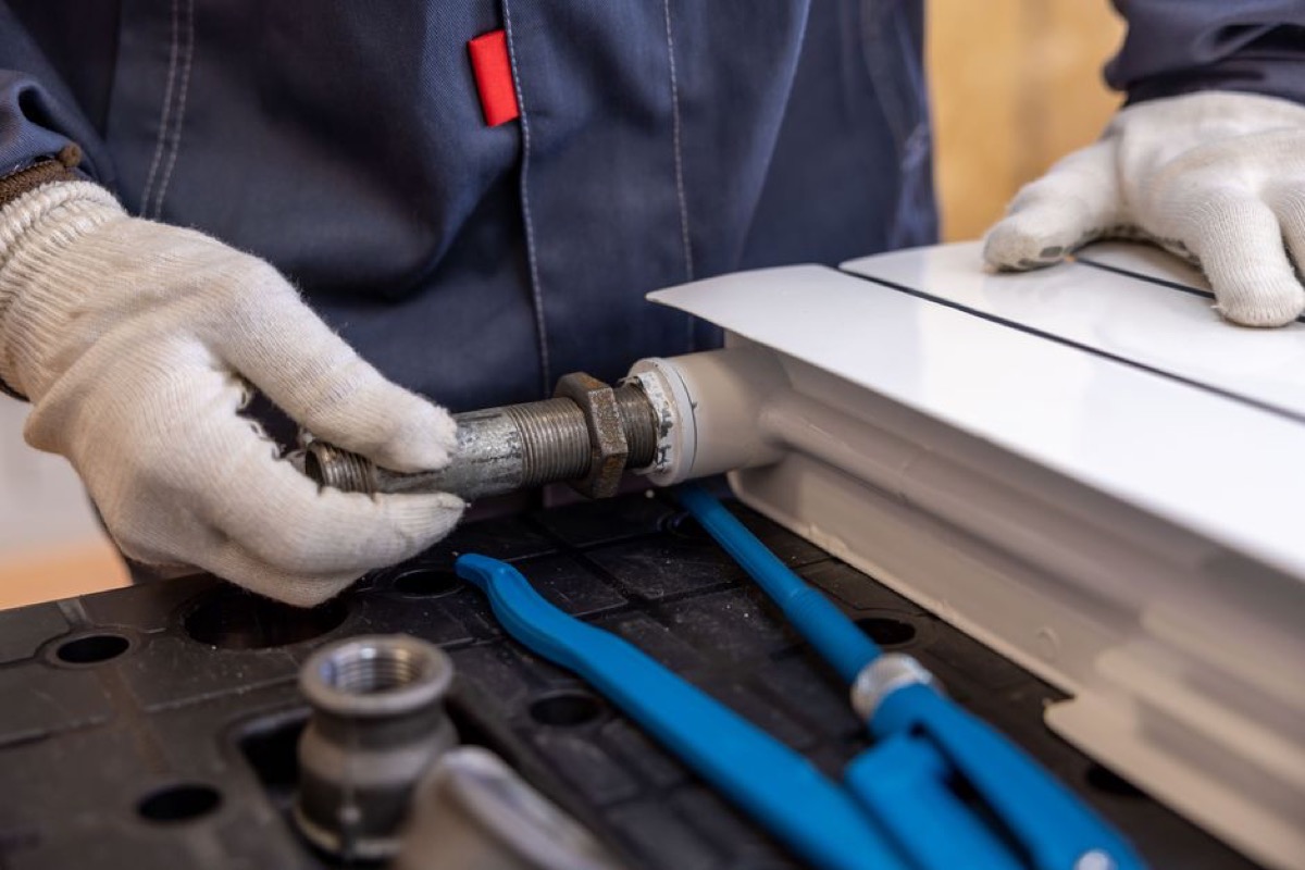 A plumber fitting pipes for a household water purification system